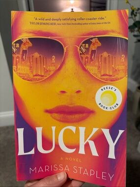 Lucky by Marissa Stapley - Vibrant Yellow & Pink Paperback